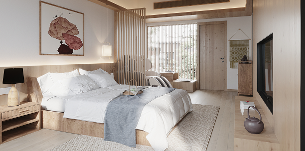 A modern, clean hotel bedroom with made bed.